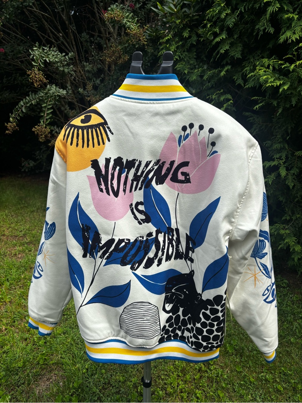Reason White Floral Graphic Varsity Jacket with Blue & Pink Accents
